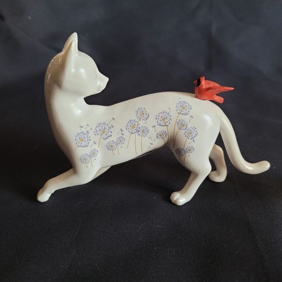 White Cat Looking Back at a Red Bird That Had Landed on His Back - Picture 4 of 12